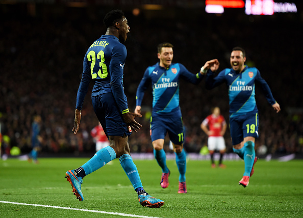 MANCHESTER, ENGLAND - MARCH 09:  Danny Welbeck (L) of Arsenal celebrates with teammates Mesut Oezil and Santi Cazorla of Arsenal after scoring his team's second goal during the FA Cup Quarter Final match between Manchester United and Arsenal at Old Trafford on March 9, 2015 in Manchester, England.  (Photo by Laurence Griffiths/Getty Images)